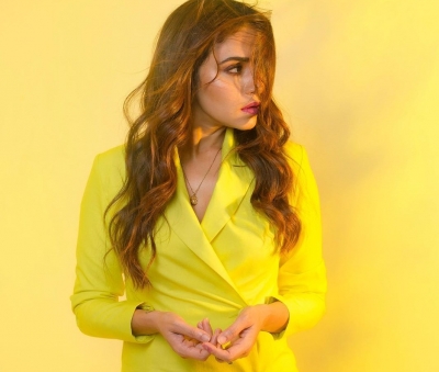 Actress Amruta Khanvilkar made a bright fashionable statement by opting for a yellow blazer dress for her recent outing.