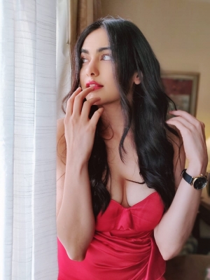 Bollywood actress Adah Sharma looked hot in a stunning red off shoulder gown. Adah looked stunning in a bright red off shoulder gown with a thigh high slit.