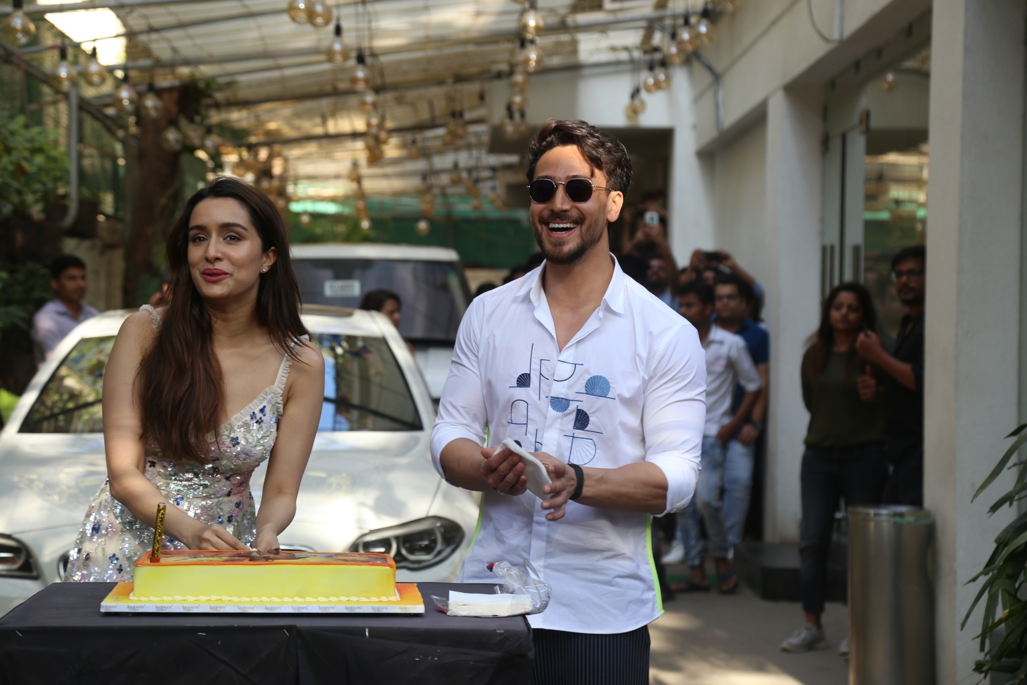 Mumbai: Actress Shraddha Kapoor accompanied by her "Baaghi 3" co-star Tiger Shroff, cuts her birthday cake during the promotions of their upcoming film in Mumbai on March 3, 2020. (Photo: IANS)