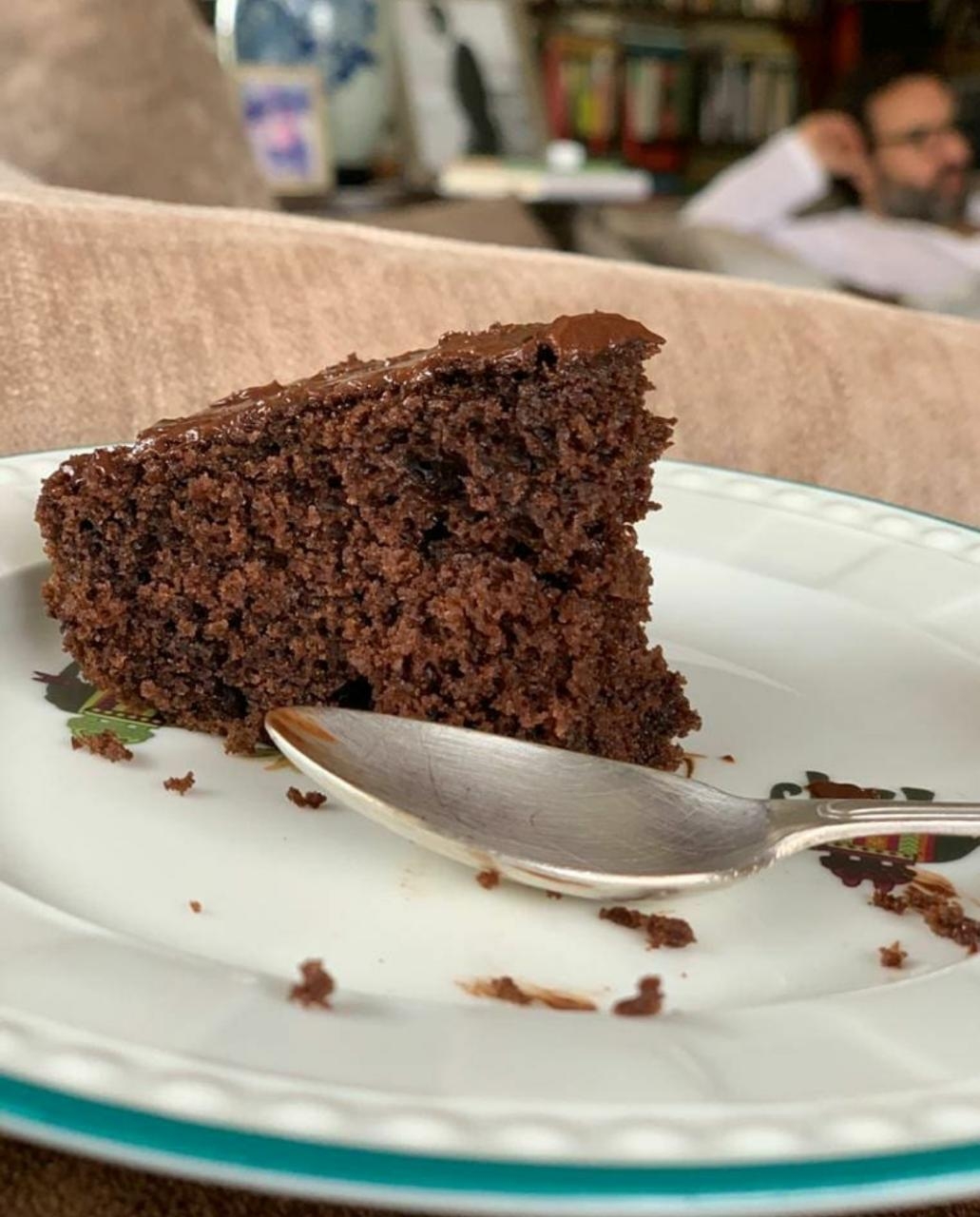 Kareena savours chocolate cake as Saif looks grumpy.
