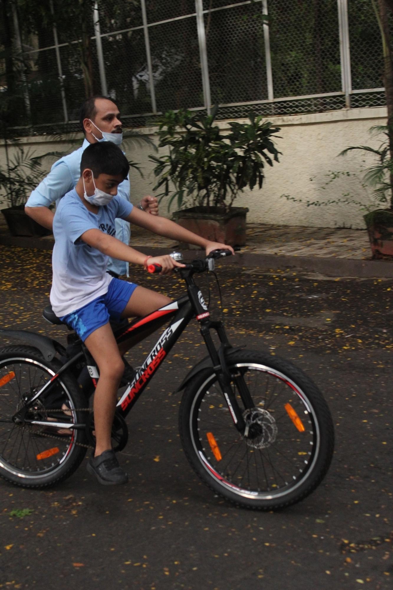 Mumbai: Bollywood actress Kajol's son Yug Devgan seen cycling in Mumbai's Juhu on July 25, 2020. (Photo: IANS)