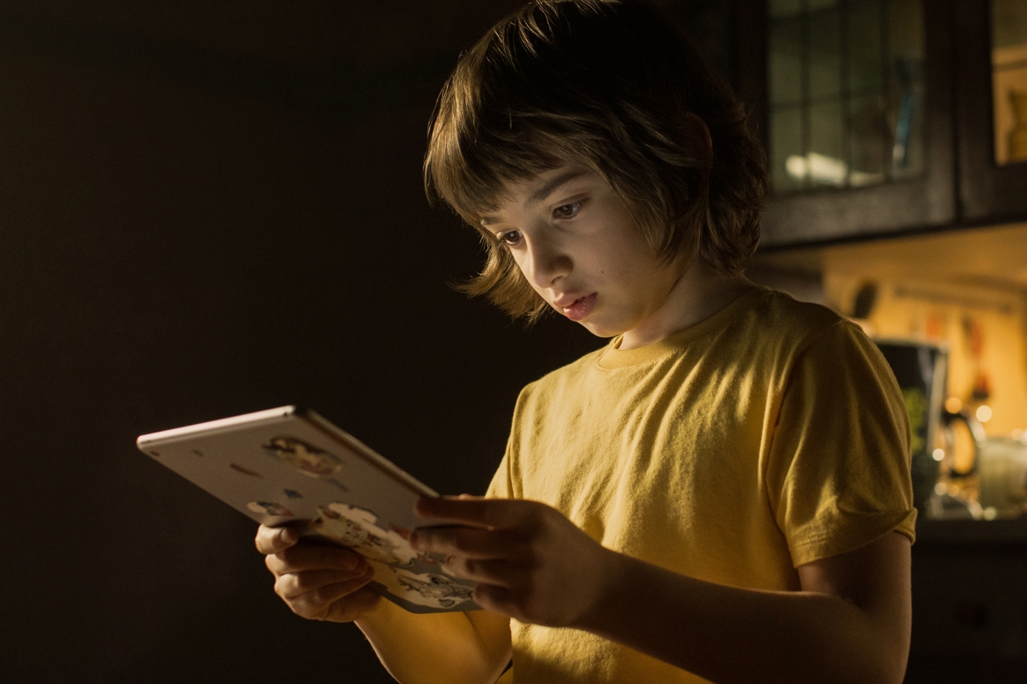 Horror film 'Come Play' probes link between technology and loneliness.