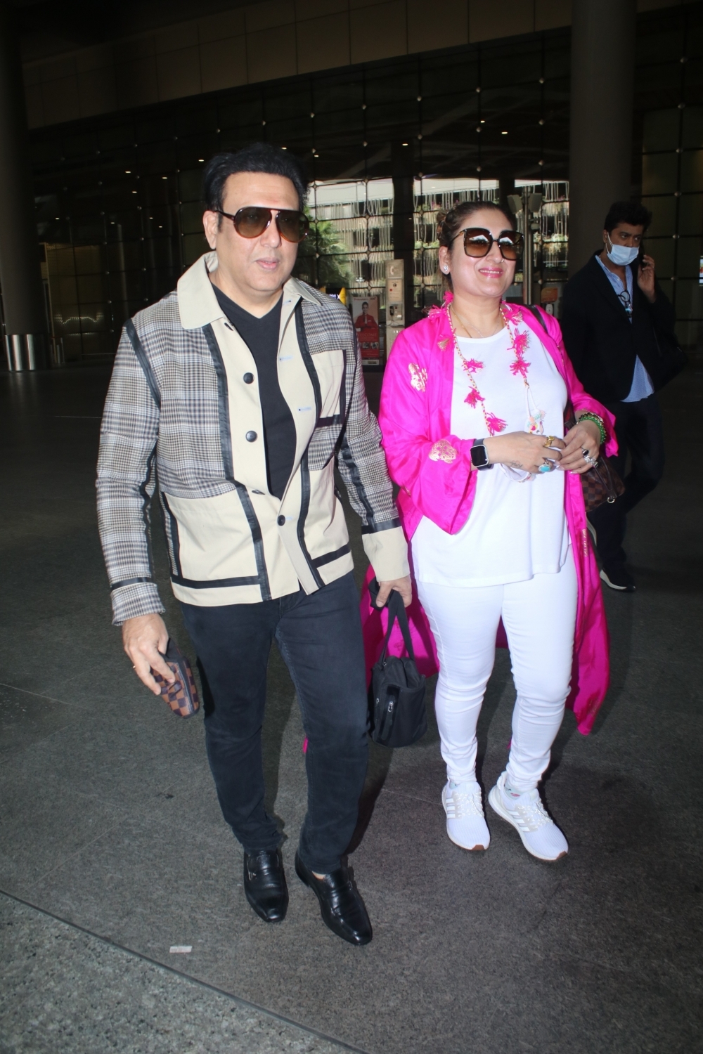 Mumbai: Govinda & Wife Sunita Ahuja spotted at airport departure on Monday 22nd February 2021. (Photo: IANS)