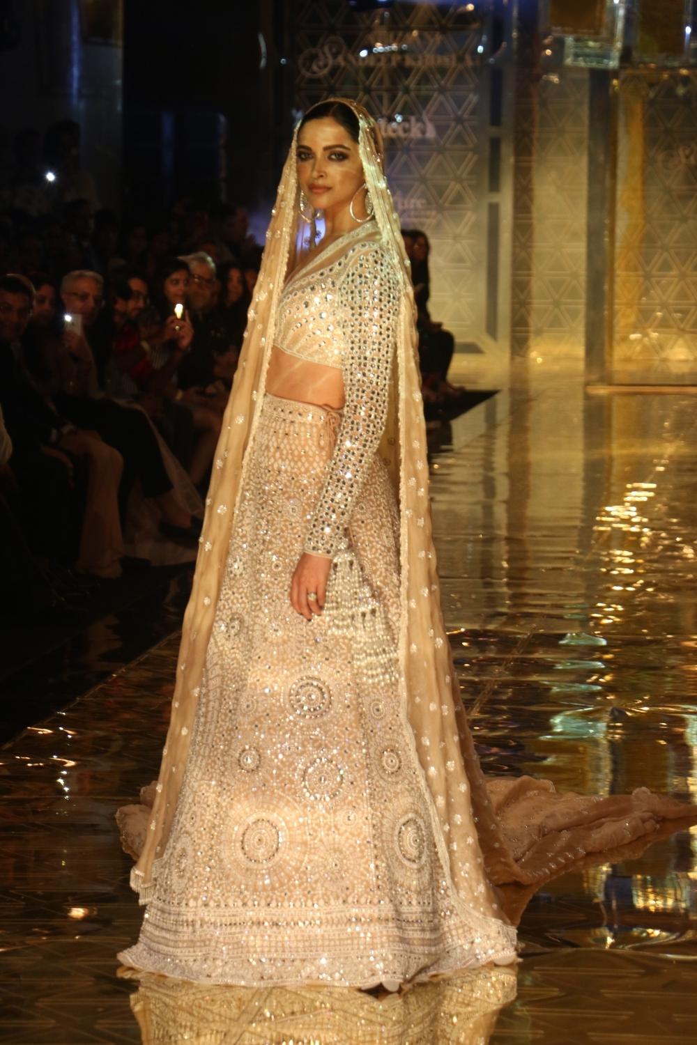 Mumbai: Actress Deepika Padukone showcases a creation of fashion designer Abu Jani-Sandeep Khosla during a fashion show in Mumbai, on Sep 5, 2019. (Photo: IANS)