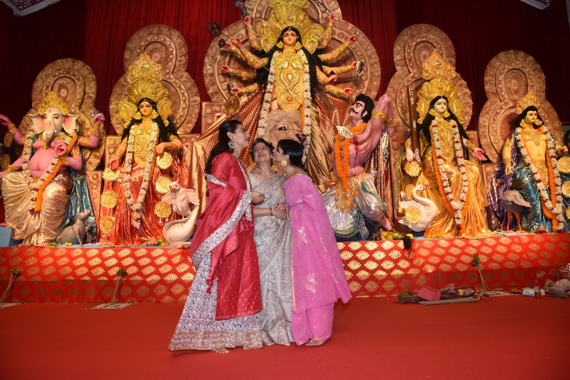 Mumbai: Actresses Kajol and Tanishaa Mukerji with thier mother Tanuja at a Durga Puja pandal in Juhu Mumbai on Oct 4, 2019. (Photo: IANS)