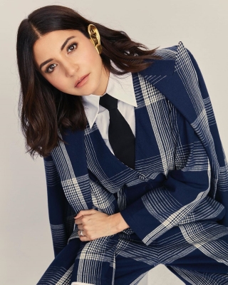 Actress Anushka Sharma took to Instagram to make a statement with her plaid jumpsuit look with formal twist, leaving actors Ranveer Singh and Arjun Kapoor gushing about her fashionable outing.