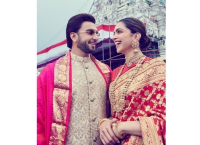 Bollywood couple Deepika Padukone and Ranveer Singh started celebrations of their first wedding anniversary on November 14 by visiting Lord Venkateswara temple. While Deepika wore a red saree with gold zari work, Ranveer looks dapper in a bandhgala beige sherwani.