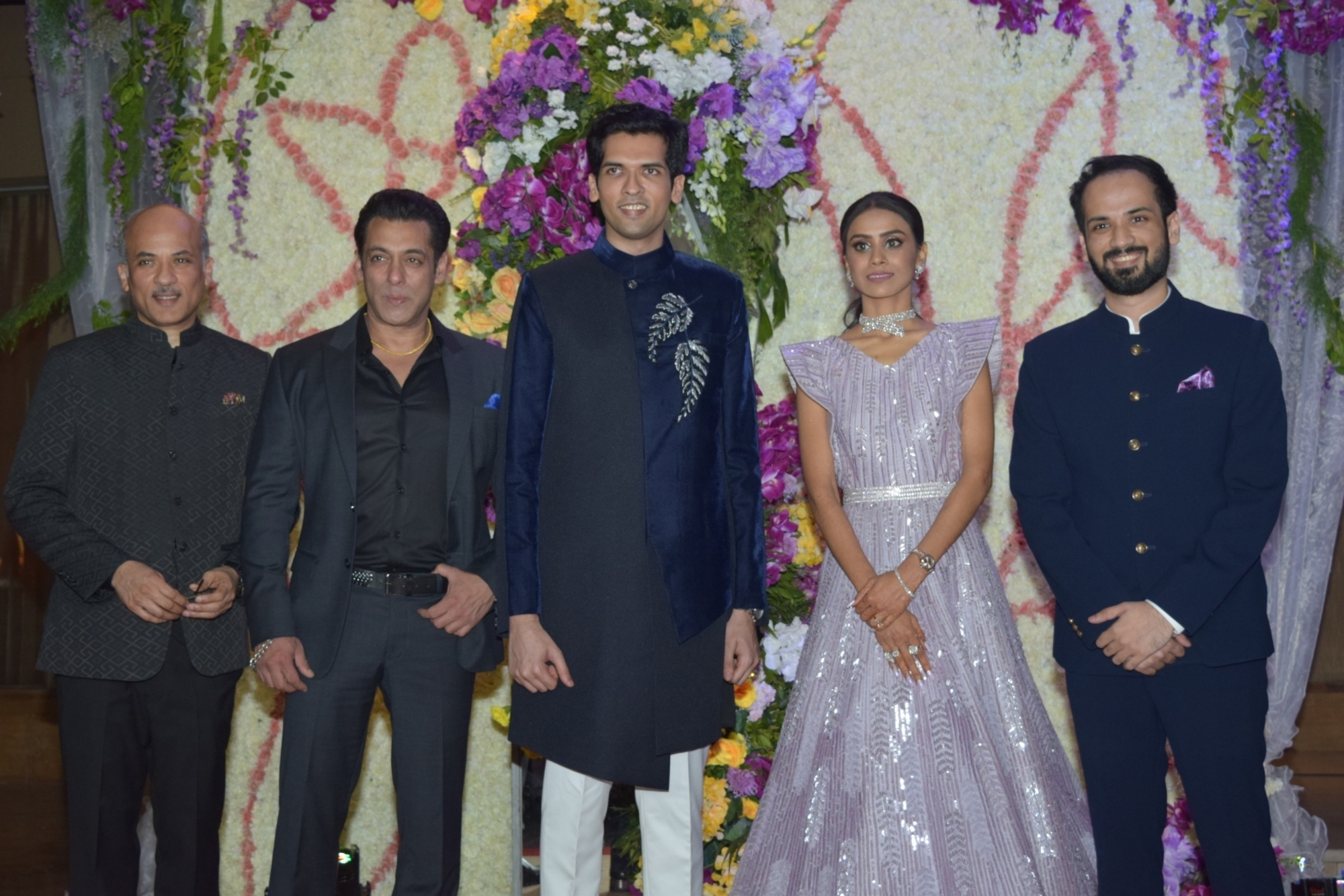 Mumbai: Filmmaker Sooraj Barjatya and actors Salman Khan and Madhuri Dixit with the newly weds Devaansh Barjatya (Sooraj Barjatya's son) and Nandini (Barjatya's daughter-in-law) at their wedding reception in Mumbai on Nov 29, 2019. (Photo: IANS)