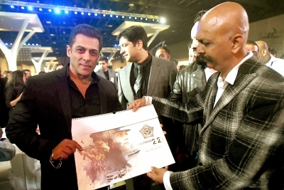 Mumbai: A copy of the Mumbai Police Calendar being presented to Bollywood superstar Salman Khan at the grand event Umang in Mumbai. (Photo: IANS)