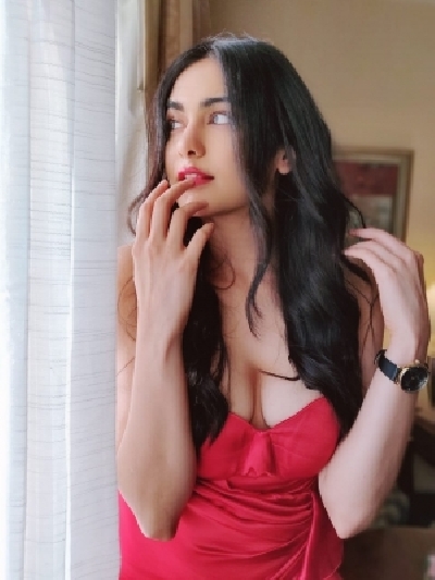 Bollywood actress Adah Sharma looked hot in a stunning red off shoulder gown. Adah looked stunning in a bright red off shoulder gown with a thigh high slit.