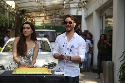 Mumbai: Actress Shraddha Kapoor accompanied by her "Baaghi 3" co-star Tiger Shroff, cuts her birthday cake during the promotions of their upcoming film in Mumbai on March 3, 2020. (Photo: IANS)