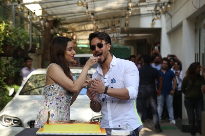 Mumbai: Actress Shraddha Kapoor accompanied by her "Baaghi 3" co-star Tiger Shroff, cuts her birthday cake during the promotions of their upcoming film in Mumbai on March 3, 2020. (Photo: IANS)