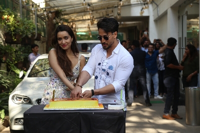 Mumbai: Actress Shraddha Kapoor accompanied by her "Baaghi 3" co-star Tiger Shroff, cuts her birthday cake during the promotions of their upcoming film in Mumbai on March 3, 2020. (Photo: IANS)