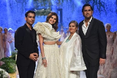 Mumbai: Actress Tara Sutaria poses with fashion designer Sulakshana Monga on Day 3 of the Bombay Times Fashion Week, in Mumbai on March 15, 2020. (Photo: IANS)