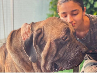 Alia Bhatt poses with Ranbir's pet dog.