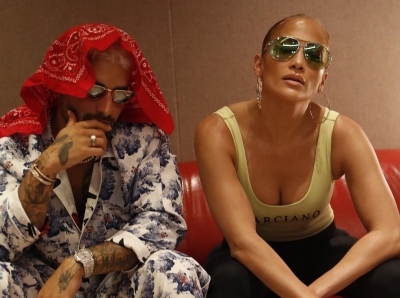 Jennifer Lopez teases new music with Maluma.