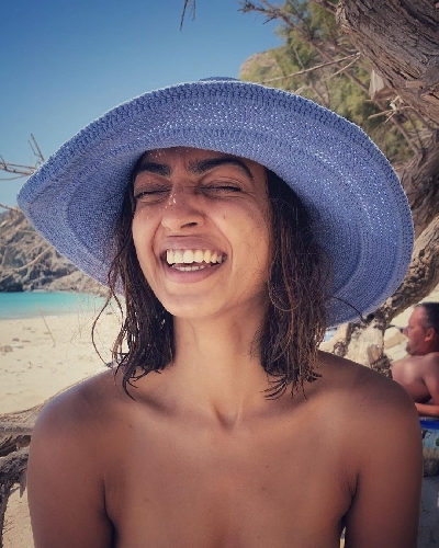 Radhika Apte shares a 'happy' picture in 'birth suit' from beach.