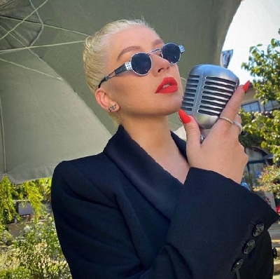 Christina Aguilera didn't find kissing Madonna in 2003 'shocking'.