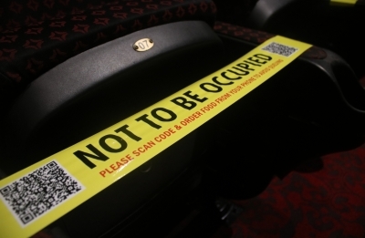 New Delhi: Precautions against COVID-19 in place at the INOX cinema hall in New Delhi on Oct 13, 2020. Cinema halls in the national capital shall reopen from October 15 amid the Covid-19 pandemic as part of Unlock 5.0. (Photo: IANS)