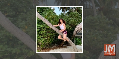 Elli AvrRam turns a flying witch riding the stick on Halloween