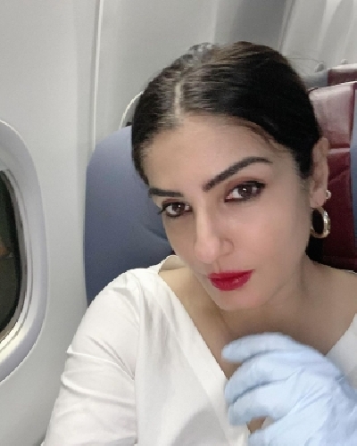 Actress Raveena Tandon has shared a picture doing her final checks before jetting off. The picture is among a string of images she has posted on Instagram that capture her various moods from fixing earrings to taking mirror selfies. Actress Raveena Tandon has shared a picture doing her final checks before jetting off. The picture is among a string of images she has posted on Instagram that capture her various moods from fixing earrings to taking mirror selfies.
