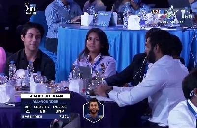 Aryan Khan flashes trademark grin as Preity Zinta laps up Shah Rukh Khan at IPL auctions.