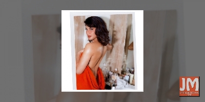 Jacqueline flaunts 'sexy back'