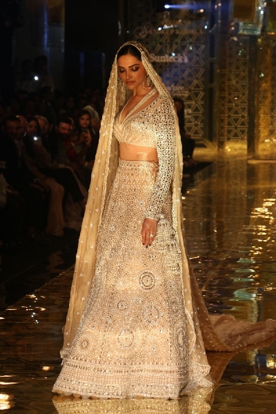 Mumbai: Actress Deepika Padukone showcases a creation of fashion designer Abu Jani-Sandeep Khosla during a fashion show in Mumbai, on Sep 5, 2019. (Photo: IANS)