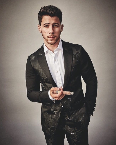 Singer Nick Jonas is thrilled about being the first person under 30 to hold a cigar and feature on the cover of Cigar Aficionado magazine. Like most of his fans, his wife and actress Priyanka Chopra went on gushing about the "yummy" singer.