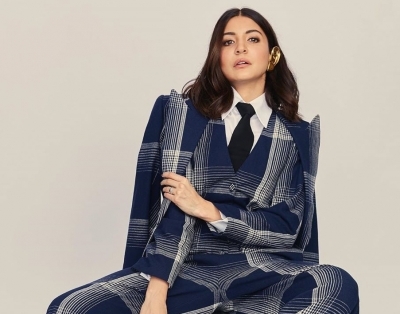 Actress Anushka Sharma took to Instagram to make a statement with her plaid jumpsuit look with formal twist, leaving actors Ranveer Singh and Arjun Kapoor gushing about her fashionable outing.