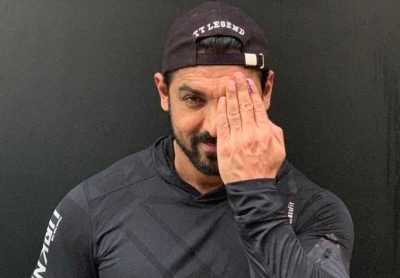 Mumbai: Actor John Abraham strikes a pose after casting his vote for the Maharashtra Assembly elections, in Mumbai on Oct 21, 2019. (Photo: IANS)