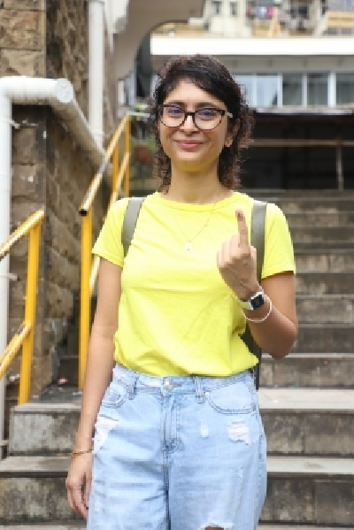Mumbai: Filmmaker and wife of Aamir Khan,  Kiran Rao shows her inked finger after casting her vote for Maharashtra assembly elections in Mumbai on Oct. 21,2 019. (Photo: IANS)