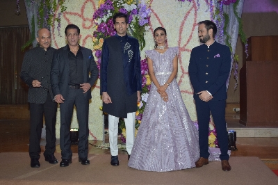 Mumbai: Filmmaker Sooraj Barjatya and actors Salman Khan and Madhuri Dixit with the newly weds Devaansh Barjatya (Sooraj Barjatya's son) and Nandini (Barjatya's daughter-in-law) at their wedding reception in Mumbai on Nov 29, 2019. (Photo: IANS)